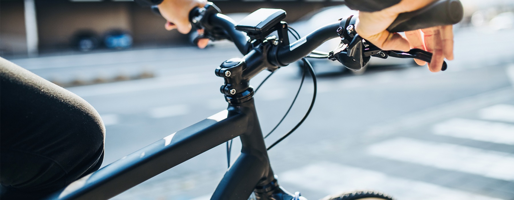 The Dylan Lifestyle person riding a black bicycle