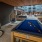 billiards table and suspended wicker chairs in outdoor lounge