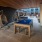 outdoor egg chairs next to billiards table in covered outdoor lounge