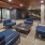 chairs surround fire pit under covered, outdoor lounge 