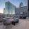 fire pit seating area and mounted tv viewing area on upper deck with neighborhood views