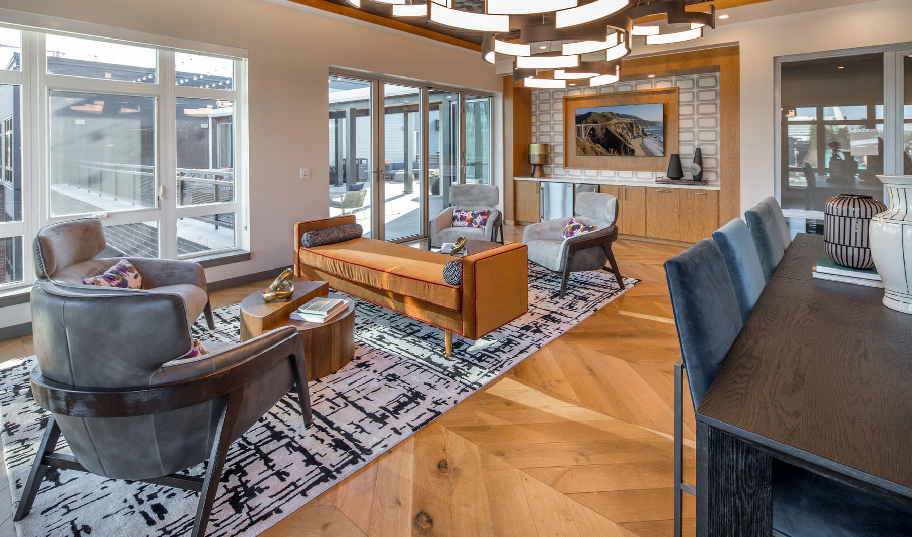 Urban artistry 7th floor community room with social seating areas and large windows
